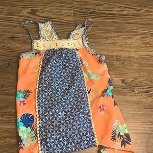 Flower shirt colorful has lace. Colors are blue, pink, purple, dark blue.